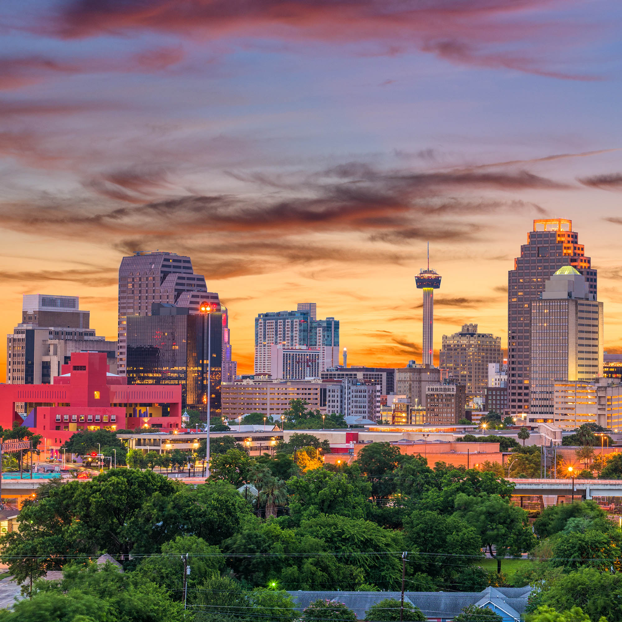 A skyline photo of San Antonio, Texas at dawn